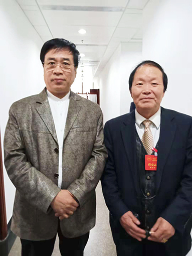 程章志老师与中国书协理事张继老师合影.jpg